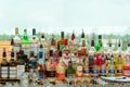 Many bottles of liquor and other alcoholic drinks with brand labels.
