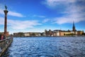 STOCKHOLM, SWEDEN - AUGUST 20, 2016: Tourists walk and visit Stockholm City Hall ( Stadshuset ) and View of Gamla Stan in Royalty Free Stock Photo