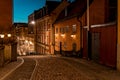 Stockholm, Sweden. Cobbled street in Sodermalm. Color street with cobblestone road, streetlight. Narrow street. Royalty Free Stock Photo