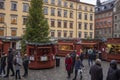 Shoppers purchase items at a Christmas village in Gamla stan, the old town of Stockholm, Sweden Royalty Free Stock Photo