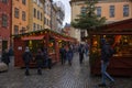 Shoppers purchase items at a Christmas village in Gamla stan, the old town of Stockholm, Sweden Royalty Free Stock Photo