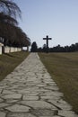 Stockholm / Sweden - 14 Febrary 2018: Road leading up to the granite cross, at the UNESCO world heritage The Woodland Cemetery Royalty Free Stock Photo