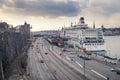 Stockholm, Sweden - 04.15.2017: Huge Birka ferry docked in the port of Stockholm with cityscape and dramatic sky in the