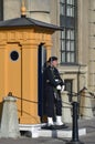 Female stand guard stationed at The Royal Palace of Stockholm in old town Gamla Stan, Stockholm, Sweden Royalty Free Stock Photo