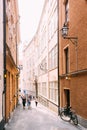 People Walking Along One Of Narrow Streets In Stockholm, Sweden Royalty Free Stock Photo