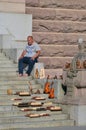 Stockholm, Sweden - July 2014: Street vendor selling handmade souvenirs at the stairway in famous touristic area of Gamla Stan