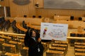 Stockholm, Sweden - July 10, 2025: A tour guide explains the history and function of the Riksdag inside the plenary hall of the Royalty Free Stock Photo