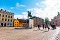 Tourists at Slottsbacken near the Stockholm Cathedral and the Royal Palace in summer.