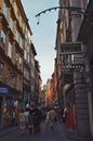 Tourists walking on the old cobble streets in the market in Gamla Stan, the old town of Stockholm in Sweden