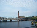 Stockholm, Sweden - July, 2007:urban landscape with views of the town hall, the river and the bridge on which the train and cars Royalty Free Stock Photo