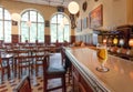 Glass of beer on bar counter of the famous restaurant Kvarnen with vintage furniture