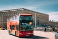 Stockholm, Sweden. Tourists People Ride In Red Hop On Hop Off Touristic Bus For Sightseeing Down The Street Near Royalty Free Stock Photo