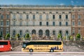Stockholm, Sweden. Yellow Touristic Bus For Sightseeing Parking Near Near Stockholm Royal Palace. Famous World Unesco Royalty Free Stock Photo