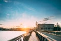 Stockholm, Sweden. Man Tourist Traveler Taking Pictures Photos Near Famous Skeppsholmsbron - Skeppsholm Bridge. Popular Royalty Free Stock Photo