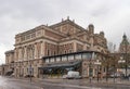 Stockholm, Sweden - May 1, 2019: Exterior view of Royal Opera House -Operan- in Stockholm, with cars and people Royalty Free Stock Photo