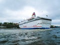 Stockholm / Sweden - May 15 2011: Viking Line ship Cinderella with flag of Sweden turning and leaving port of Stockholm Royalty Free Stock Photo