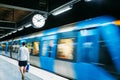 Stockholm, Sweden. Modern Illuminated Metro Underground Subway Station In Blue And Gray Colors With Moving Train Royalty Free Stock Photo