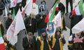 Protesters with Iranian flags and posters attend demonstration and protest against Moderate Rouhani executions in Iran Royalty Free Stock Photo