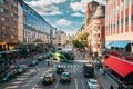 Stockholm, Sweden. Red Hop On Hop Off Touristic Bus For Sightseeing Riding Down The Vasagatan Street. City Tour Bus. Royalty Free Stock Photo