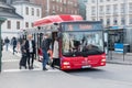 Passengers boarding a red city bus in Stockholm Royalty Free Stock Photo