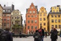 Stockholm, Sweden September 24, 2017: Tourists take pictures of colorful houses on Stortorget Square in the Old Town Royalty Free Stock Photo