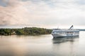 Stockholm, Sweden, 08.08.2021: Silja Line Symphony cruise ship at morning. Beautiful pink golden clouds. Panoramic View of Swedish