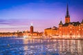 Stockholm, Sweden. Sunset over Gamla Stan and frozen Lake Malaren