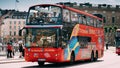 Stockholm, Sweden. Tourists People Ride In Red Hop On Hop Off Touristic Bus For Sightseeing Down The Street Near Royalty Free Stock Photo