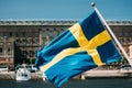 Stockholm, Sweden. Waving Swedish Flag In Stockholm Street Royalty Free Stock Photo