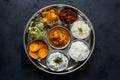 StockImage A colorful and flavorful vegetarian Indian thali presented in studio
