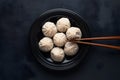 StockImage Traditional Korean Mandu dumplings presented elegantly with chopsticks