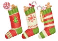 Christmas colorfull socks and sweet gifts. Watercolor image. Royalty Free Stock Photo