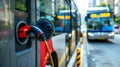 Stockphoto, copy space, modern public transport bus charging on an electric charging point, renewable energy theme.