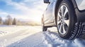 stockphoto, Winter tire. SUV car on snow road. Tires on snowy highway detail. close up view. Space for text