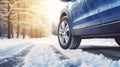 stockphoto, Winter tire. SUV car on snow road. Tires on snowy highway detail. close up view. Space for text.