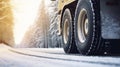 stockphoto, Winter tire. truck on snow road. Tires on snowy highway detail. close up view. Copy space.