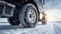 stockphoto, Winter tire. truck on snow road. Tires on snowy highway detail. close up view. Copy space