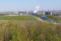 Stockpile Beckstrasse to the ski hall on the slope, in an industrial environment with partly heavily smoking chimneys