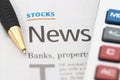 Stocks News, pen, calculator, banks, property headlines