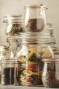 Stocks or set of cereals, pasta, groats, organic legumes and useful seeds in glass jars. Vegan source of protein and energy Royalty Free Stock Photo