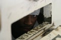 Prisoner looking out cell door tray slot