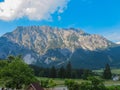 Stoderzinken - Majestic mountains dominates landscape in Stoderzinken, bathed in sunlight under vibrant blue sky Royalty Free Stock Photo