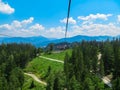 Stoderzinken - Thrilling zipline ride glides over lush green alpine meadows and dense forests at Stoderzinken, Austria Royalty Free Stock Photo