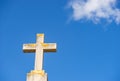 Christian cross against blue cloudy sky background Royalty Free Stock Photo