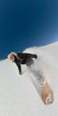 Stoked snowboarder girl carving off trail high in sunny mountains. Royalty Free Stock Photo