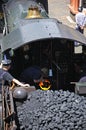 Stoking the boiler on steam locomotive. Royalty Free Stock Photo