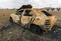 Stolen, abandoned, and burned out car. Royalty Free Stock Photo