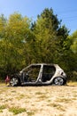 A stolen car which has been burnt out and dumped in a field