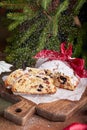 Stollen Christmas cake with nuts, spices, dried and candied fruit, coated with powdered sugar