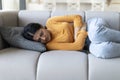Stomach Ache. Sick Young Indian Female Suffering From Abdominal Pain At Home Royalty Free Stock Photo